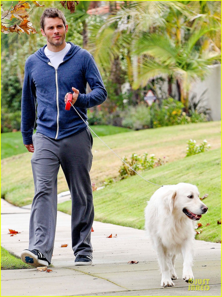 James Marsden taking his white Golden Retriever for a walk outdoors