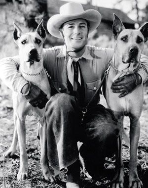 Randolf Scott in between his two Great Danes