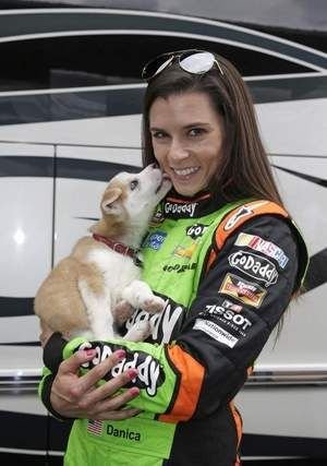 Danica Sue Patrick carrying her Husky puppy