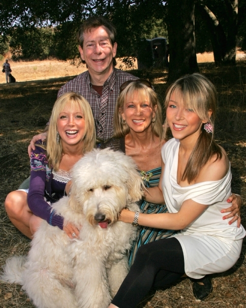 Courtney Peldon and Ashley Peldon with their Labradoodle