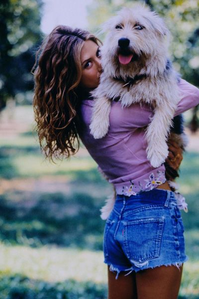 Jennifer Aniston carrying her Labradoodle
