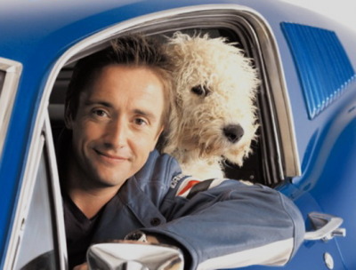 Richard Hammond inside car with his Labradoodle behind him