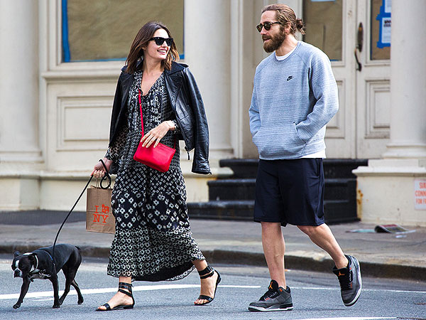 Alyssa Miller walking in the street with her Boston Terrier