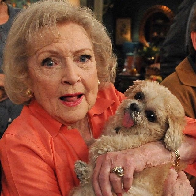 Betty White holding her Shih Tzu