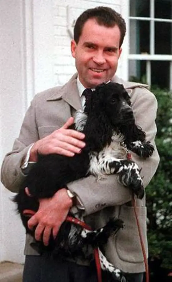 Richard Nixon with his Cocker Spaniel in his arms