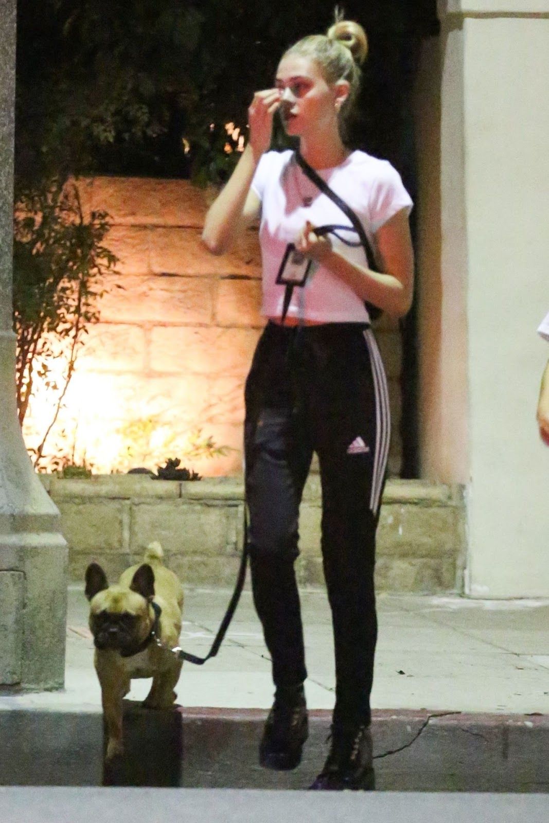 Nicola Peltz with her French Bulldog outdoors