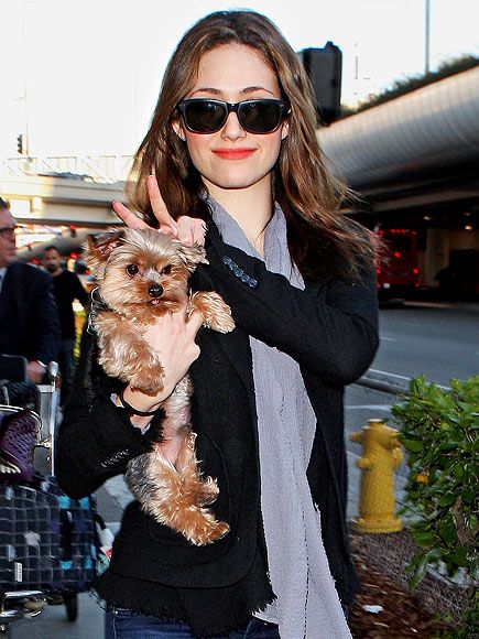 Emmy Rossum holding her Yorkie