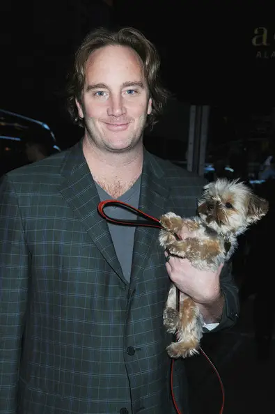 Jay Mohr carrying his Yorkie dog