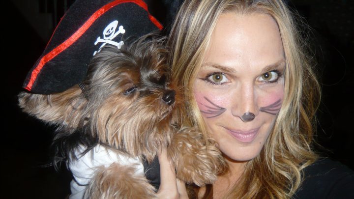 Molly Sims holding her Yorkie in pirate costume