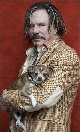 Mickey Rourke with Chihuahua in his arms