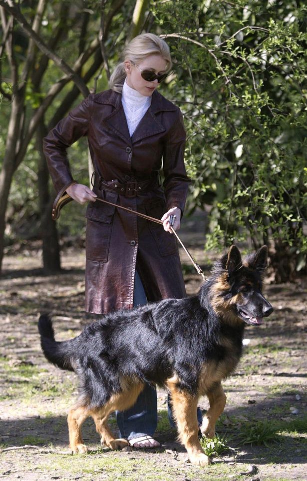 Claudia Schiffer at the park with his German Shepherd