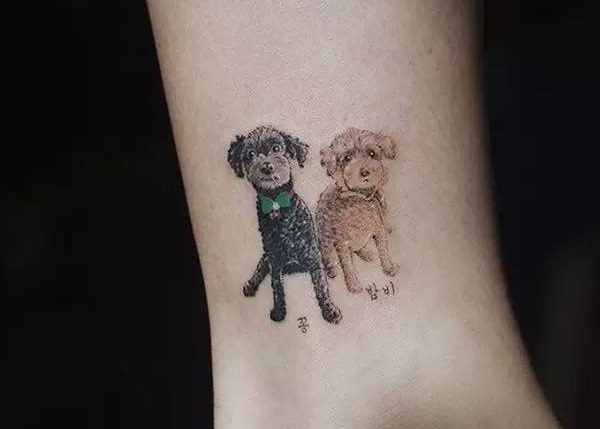 two sitting Goldendoodles tattoo on the ankle