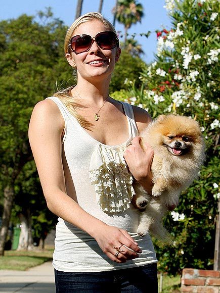 LeAnn Rimes at the park carrying her smiling LeAnn Rimes