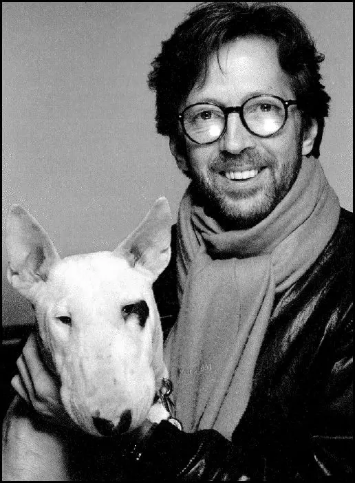black and white photo of Eric Clapton with his Bull Terrier