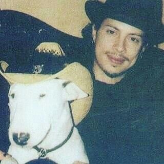 Kirk Hammett with his Bull Terrier wearing a cowboy hat