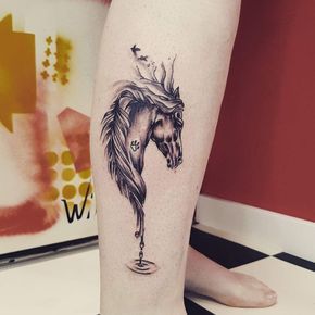 head of a Horse tattoo on the leg