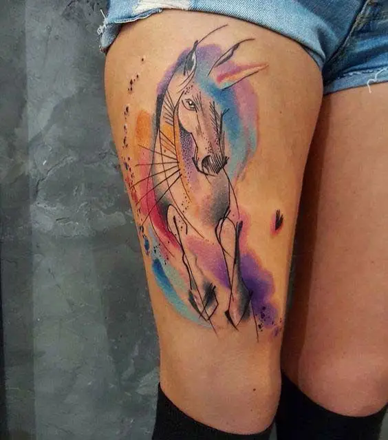 outline of a Horse with watercolor tattoo on the thigh