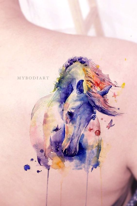 a watercolor Horse tattoo on the back of a woman