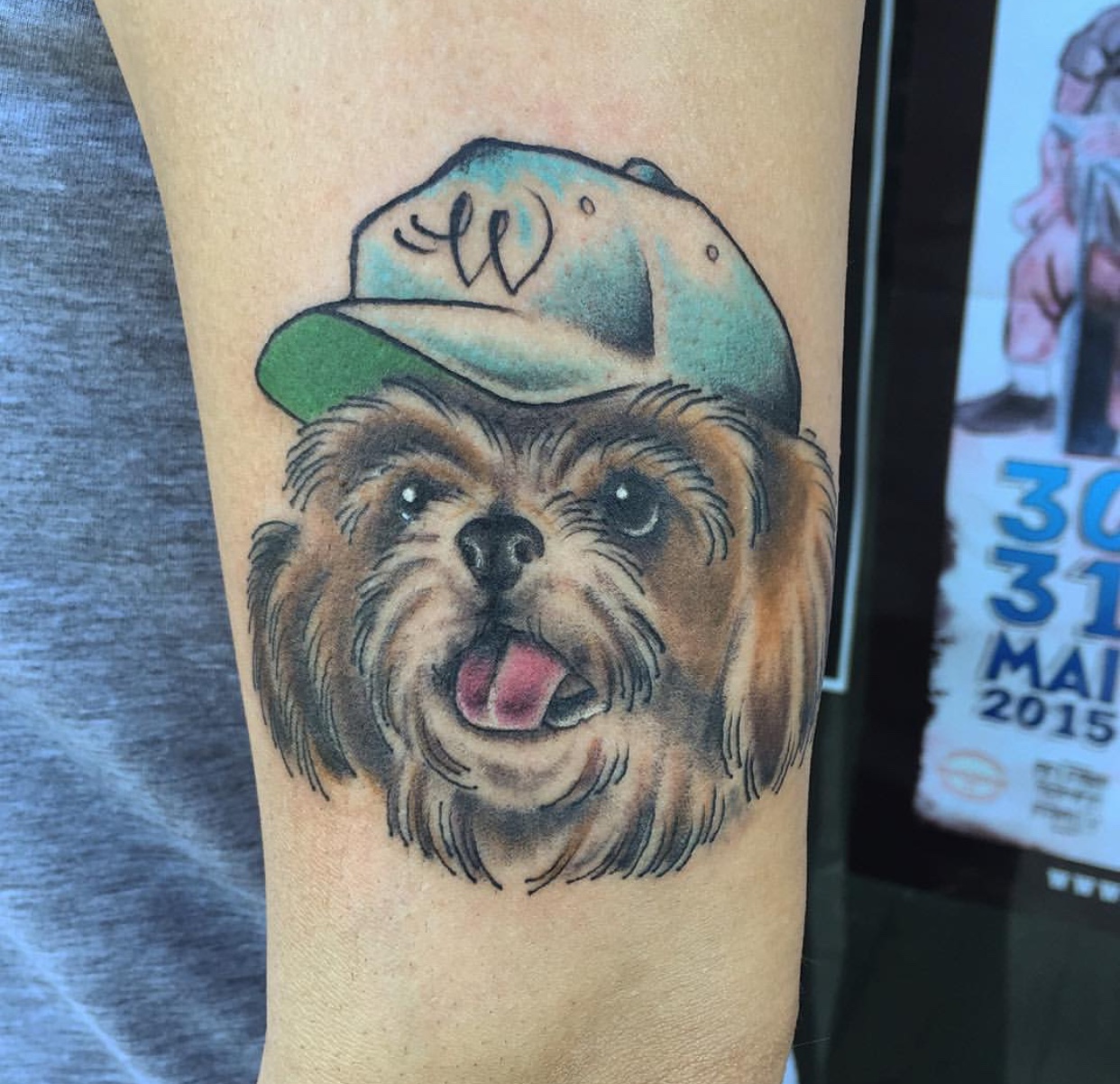 Shih Tzu wearing a cap on its head tattoo on the forearm