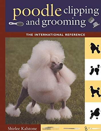 book cover with title- Poodle Clipping and Grooming: The International Reference (Howell Reference Books), and a photo of a white poodle standing on the green grass in its show haircut