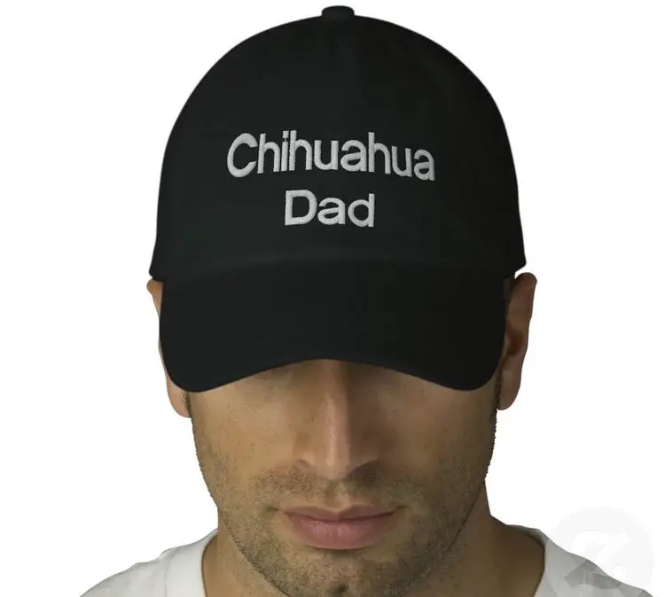 a man wearing a black chihuahua with - Chihuahua Dad