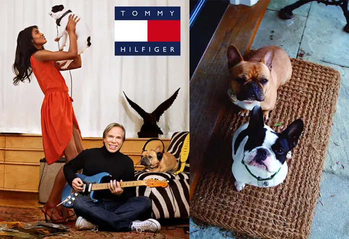 Tommy Hilfiger with a woman and their two French Bulldogs