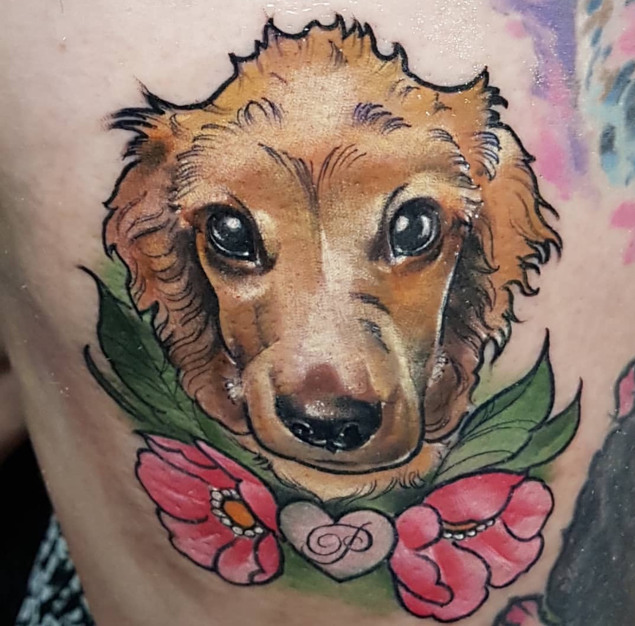 animated face of Cocker Spaniel with flowers and leaves tatoo