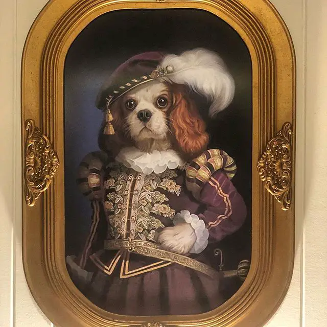 a royal Cavalier King Charles Spaniel artwork in a frame