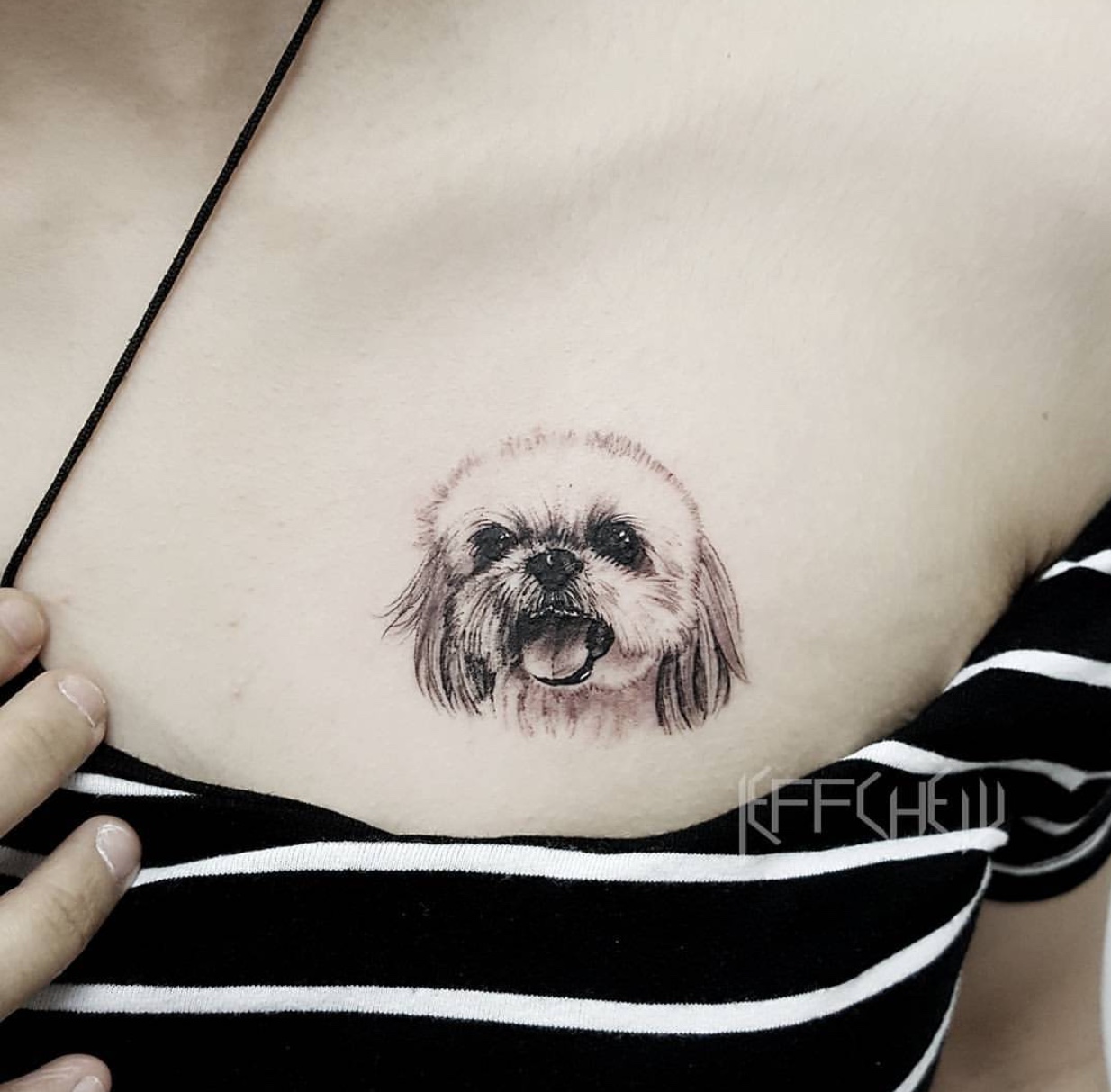 face of Shih Tzu opening its mouth tattoo on the chest