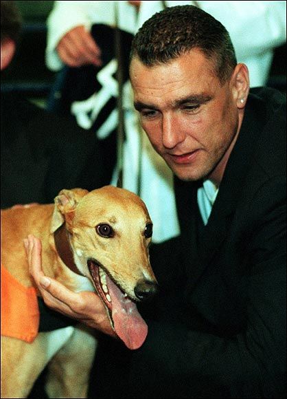 Vinnie Jones petting his greyhound