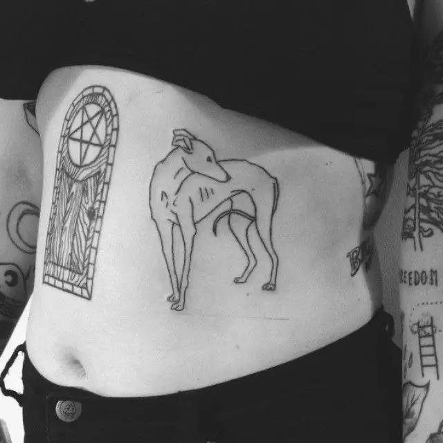 skinny Greyhound tattoo on the stomach