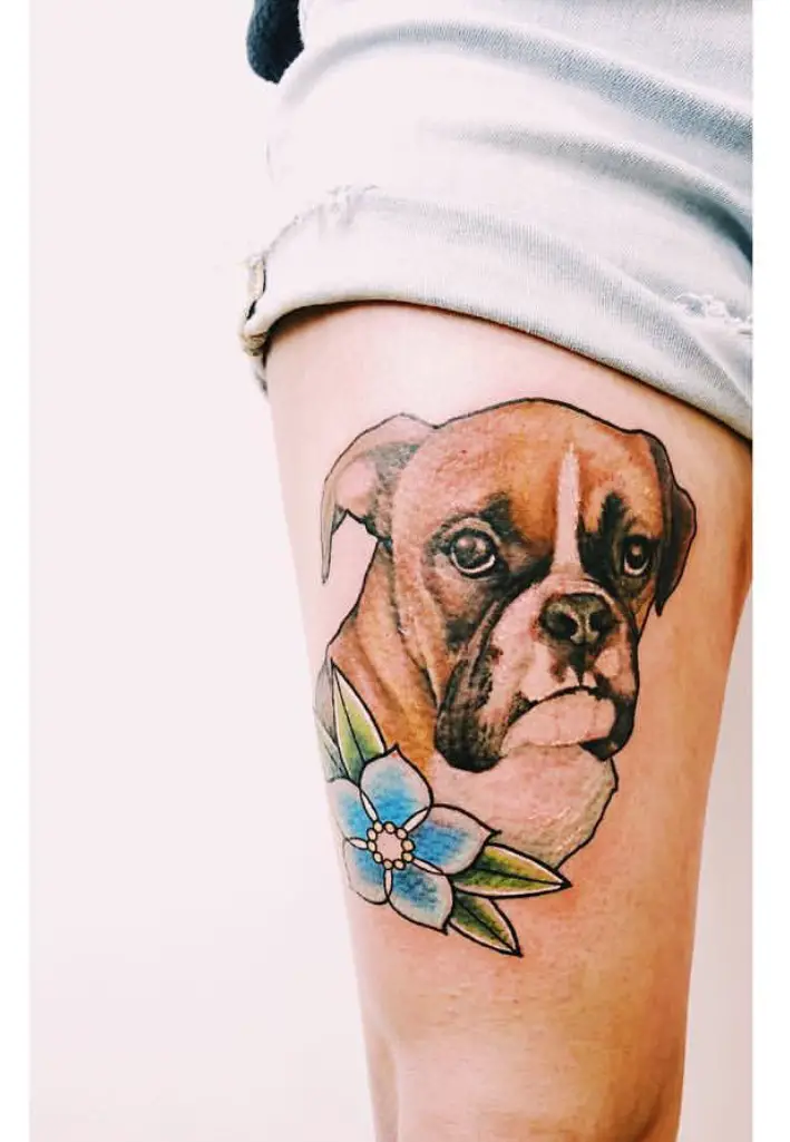 An artistic face of a Boxer with flower tattoo on the thigh