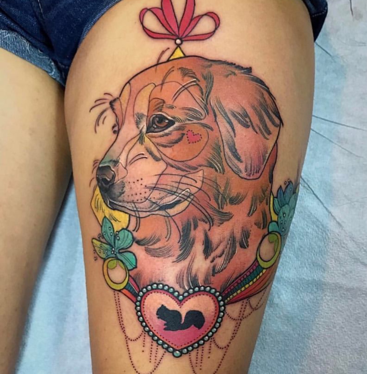 artistic sideview face of a Labrador Retriever tattoo on thigh
