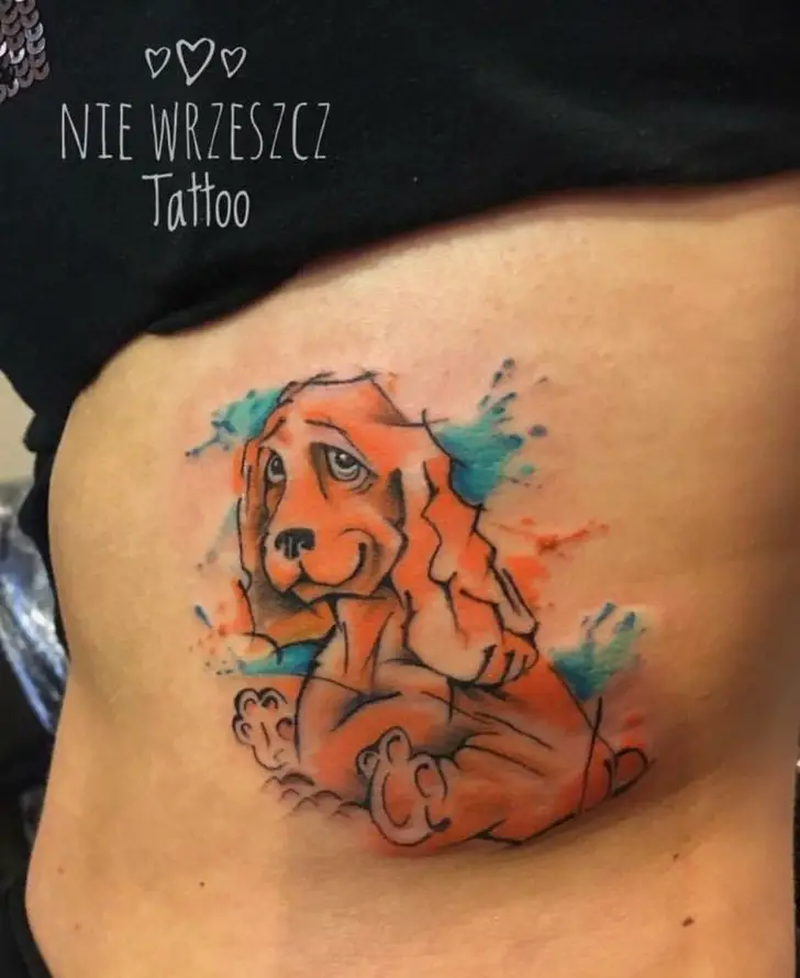sketch style Cocker Spaniel with watercolor tattoo on the back