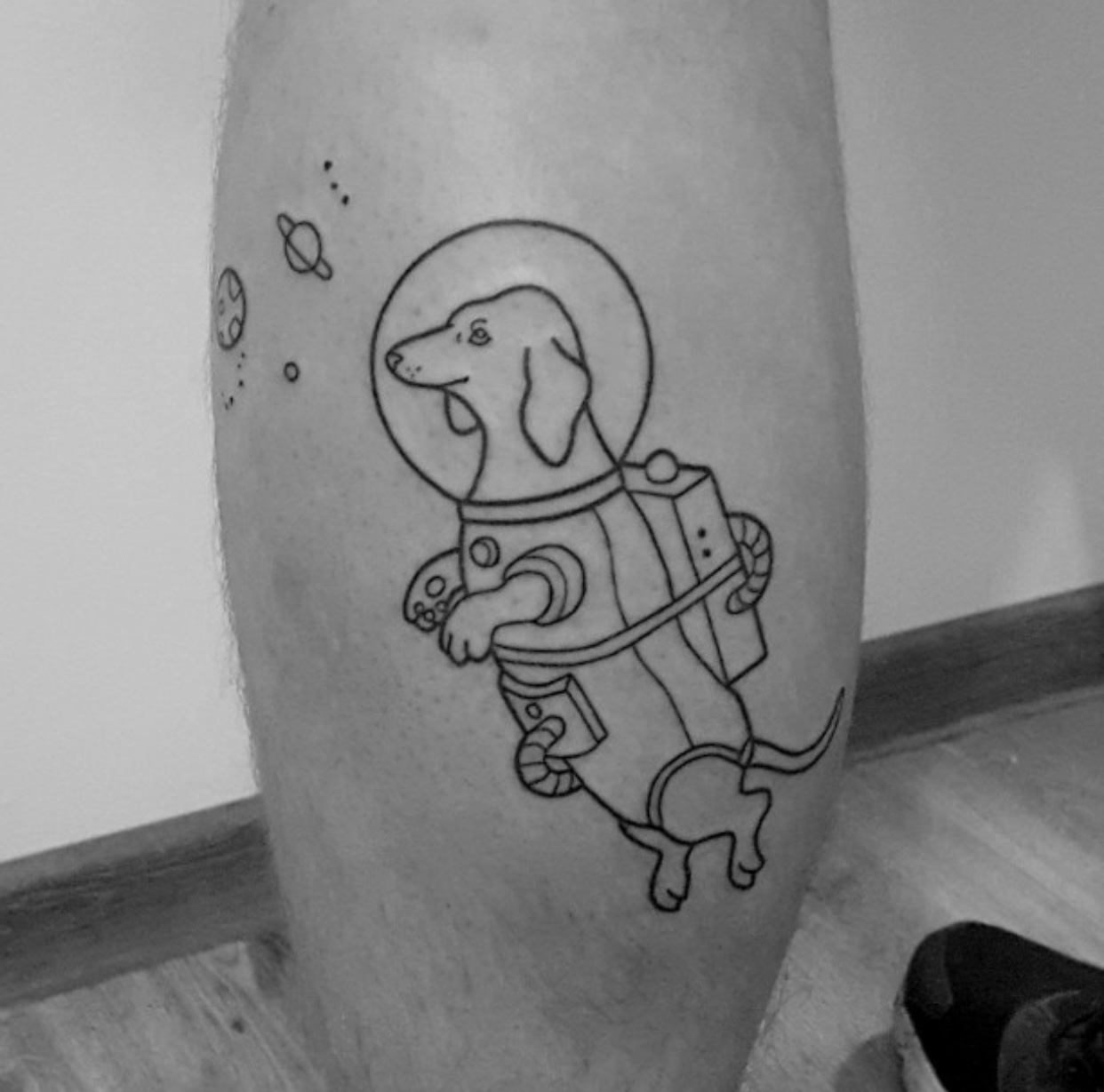 astronaut Dachshund tattoo on leg