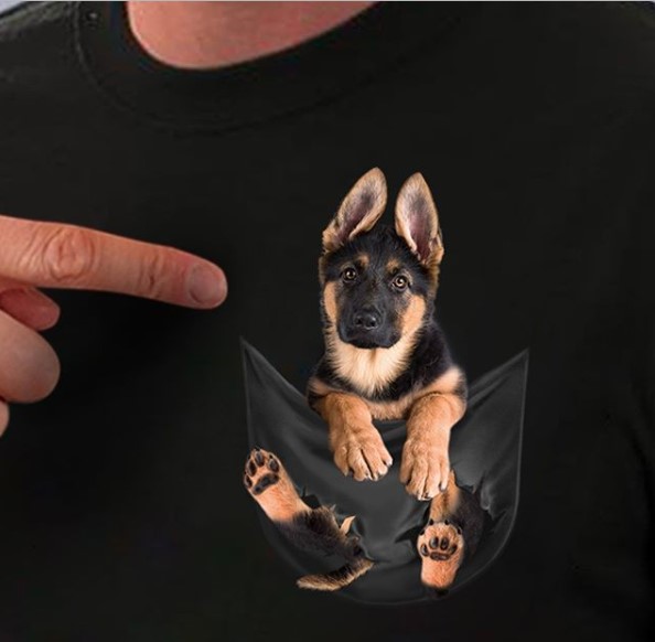 pointing a finger to the German Shepherd Puppy on a tshirt
