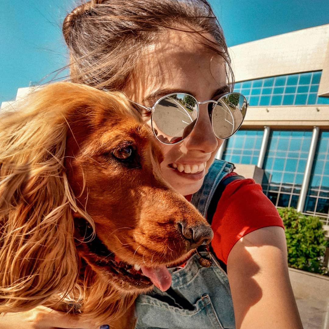 a woman taking a selfie with her Cocker Spaniel